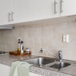 Make It Pop: Designing a Light, Welcoming Kitchen with Black Cabinet Fronts